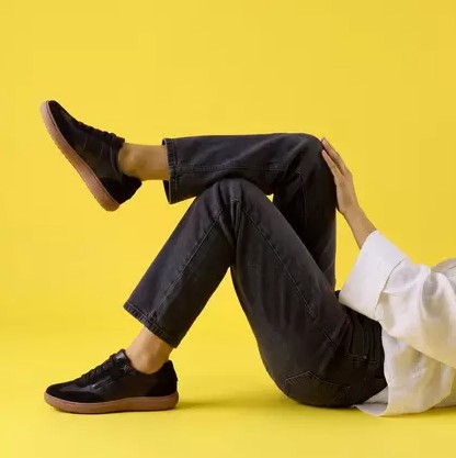 Woman Wearing Clarks Nalle T Toe with Yellow Background