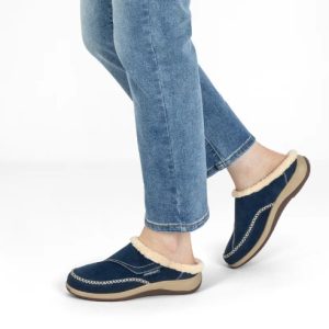 Woman Wearing Orthofeet Charlotte Slipper in Sapphire with Blue Jeans