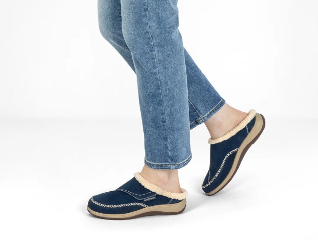 Woman Wearing Orthofeet Charlotte Slipper in Sapphire with Blue Jeans