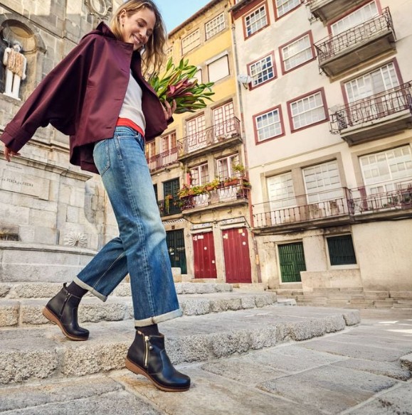 Woman Wearing Pikolino Granada in Black Carrying Flowers