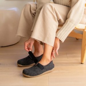 Woman Putting On Sanita Varde Slipper in Charocal