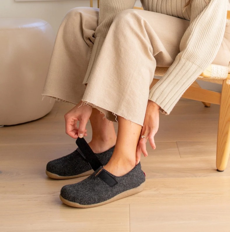 Woman Putting On Sanita Varde Slipper in Charocal